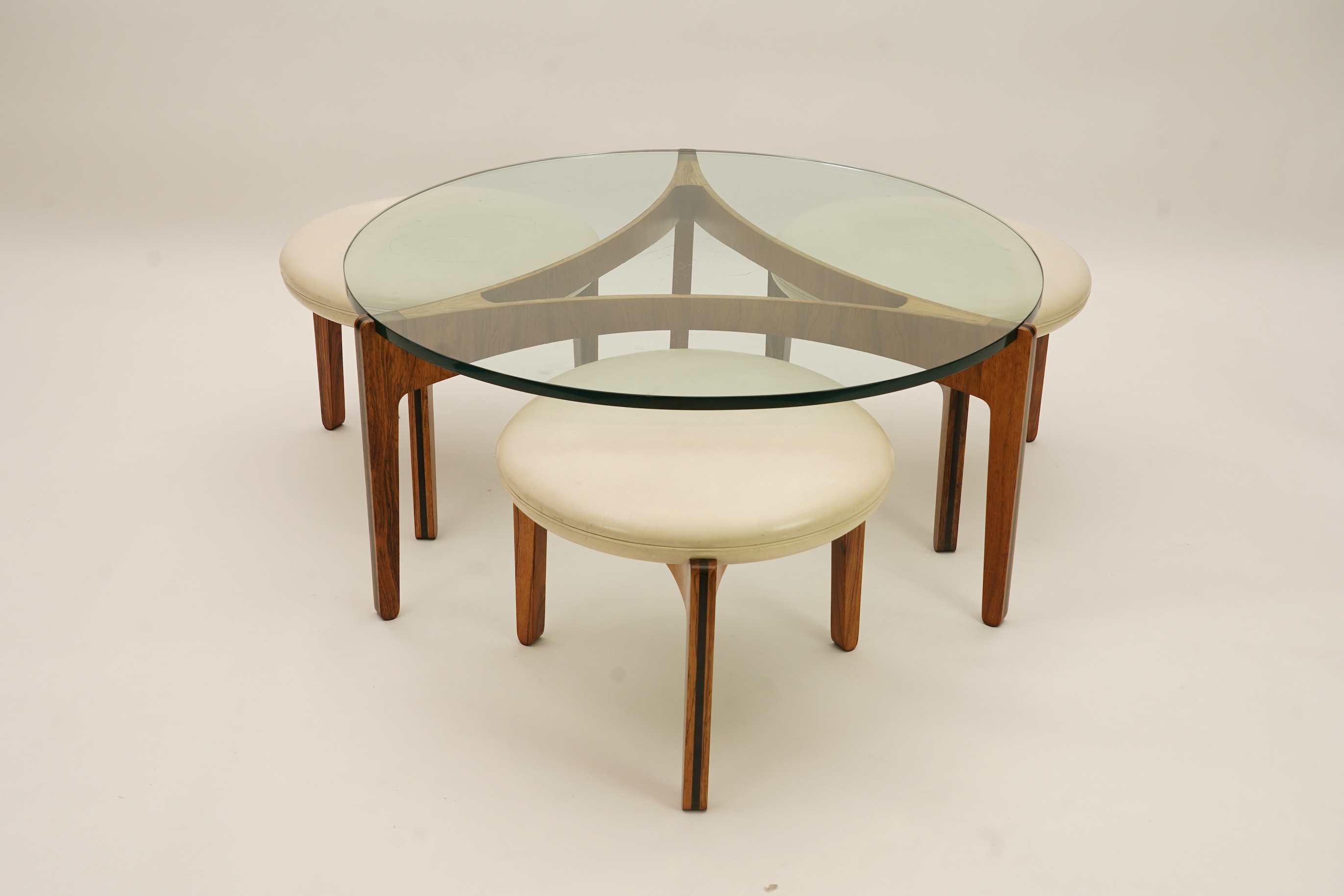 Sven Ellekaer (Danish, 1926-1984) for Christian Linneberg Møbelfabrik: A coffee table and three nesting stools ensuite